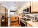 Updated kitchen with stainless appliances, wood floors and bright lighting at 452 Black Feather Loop # 608, Castle Rock, CO 80104