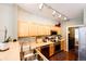 Bright kitchen with wood cabinets, stainless steel appliances, and hardwood floors at 452 Black Feather Loop # 608, Castle Rock, CO 80104