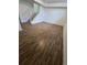 Finished basement with laminate flooring and staircase at 11761 E Canal Dr, Aurora, CO 80011