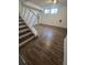 Finished basement area features a staircase and natural light from an egress window at 11761 E Canal Dr, Aurora, CO 80011