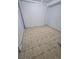 Basement area with neutral tile flooring and white walls at 11761 E Canal Dr, Aurora, CO 80011