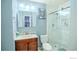 Updated bathroom with marble walk-in shower, vanity, and toilet at 11761 E Canal Dr, Aurora, CO 80011