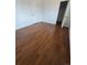 Bedroom with laminate flooring and a closet at 11761 E Canal Dr, Aurora, CO 80011