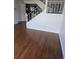 Open entryway featuring hardwood floors and staircase at 11761 E Canal Dr, Aurora, CO 80011