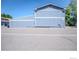 Exterior of building with blue paneling under a clear, blue sky at 11761 E Canal Dr, Aurora, CO 80011