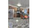 Well-equipped kitchen with stainless steel appliances, granite counters, and tile backsplash at 11761 E Canal Dr, Aurora, CO 80011