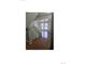 Spacious open living room with hardwood floors and staircase at 11761 E Canal Dr, Aurora, CO 80011