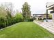 Well maintained backyard with green lawn and access to the home's pool and outdoor kitchen at 140 S Glencoe St, Denver, CO 80246