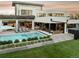 Stunning backyard featuring a modern pool, outdoor seating, and lush landscaping at 140 S Glencoe St, Denver, CO 80246