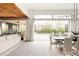 Bright dining room with outdoor views and access, alongside a modern living space at 140 S Glencoe St, Denver, CO 80246