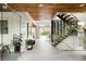 Bright entryway featuring wood ceilings, tile floors, glass-enclosed staircase, and a view to the pool at 140 S Glencoe St, Denver, CO 80246