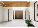 Bright entryway with natural wood accents, light tile floors, and modern design at 140 S Glencoe St, Denver, CO 80246