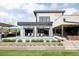 Modern home with a backyard oasis featuring a pool, outdoor kitchen, covered patio, and landscaped yard at 140 S Glencoe St, Denver, CO 80246
