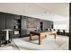 Spacious game room featuring a pool table, wet bar, and stylish design elements at 140 S Glencoe St, Denver, CO 80246