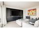 Cozy living room with a large built-in entertainment center, sectional sofa, and modern decor at 140 S Glencoe St, Denver, CO 80246