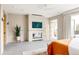 Bright main bedroom features a fireplace, sitting area, private deck access, and an en-suite bathroom at 140 S Glencoe St, Denver, CO 80246