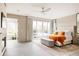 Bright main bedroom with private deck access, fireplace, sitting area, and an en-suite bathroom at 140 S Glencoe St, Denver, CO 80246