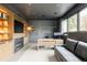 Contemporary office featuring built-in shelving, a fireplace, and a sleek workstation at 140 S Glencoe St, Denver, CO 80246