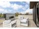 Relaxing outdoor patio with a fireplace, modern seating, and sleek design at 140 S Glencoe St, Denver, CO 80246