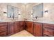 Elegant bathroom with double vanity, vessel sinks, and unique tiled accent wall at 7821 Inverness Blvd, Englewood, CO 80112