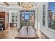 Dining area with large windows, modern light fixture and a view of the neighborhood at 7821 Inverness Blvd, Englewood, CO 80112