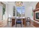 Dining area featuring large windows, modern light fixture, and neighborhood view at 7821 Inverness Blvd, Englewood, CO 80112