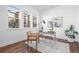 Bright home office with hardwood floors, a modern desk, natural light, and neighborhood views at 7821 Inverness Blvd, Englewood, CO 80112