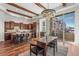 Open kitchen featuring a center island, hardwood floors, and modern lighting fixtures at 7821 Inverness Blvd, Englewood, CO 80112