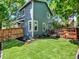 Exterior back-yard view with lush lawn, landscaping, and wooden deck at 453 Arden Cir, Highlands Ranch, CO 80126