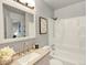Bathroom featuring a vanity with a stone countertop and a bathtub with a shower at 453 Arden Cir, Highlands Ranch, CO 80126