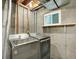 Basement laundry room showcasing modern washer and dryer with exposed utilities at 453 Arden Cir, Highlands Ranch, CO 80126