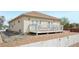 The backyard includes a large wood deck and a lot surrounded by a white picket fence at 725 High St, Erie, CO 80516