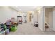 Finished basement area with workout equipment and carpet flooring at 725 High St, Erie, CO 80516