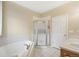 Inviting bathroom features a corner tub, glass enclosed shower, and double sinks with a well lit mirror at 725 High St, Erie, CO 80516