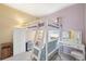 Charming bedroom with a cozy lofted bed, vanity, wardrobe, and light-filled window with soft, natural lighting at 725 High St, Erie, CO 80516