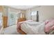 Bedroom with glass paneled doors to deck and a triple dresser at 725 High St, Erie, CO 80516