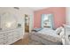 Well-lit bedroom with coordinating furniture and natural light from the window at 725 High St, Erie, CO 80516