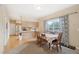 Inviting dining room with natural light and a seamless transition to the adjacent kitchen at 725 High St, Erie, CO 80516