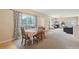 Comfortable dining room flowing into the living area, with a large window for abundant natural light at 725 High St, Erie, CO 80516