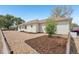 Single-story home with gravel landscaping and wood fence offers inviting curb appeal under a blue sky at 725 High St, Erie, CO 80516