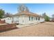 Charming single-story home featuring a cozy front porch and a low-maintenance gravel yard at 725 High St, Erie, CO 80516