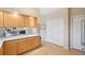 Open kitchen layout featuring bright cabinetry and stainless steel appliances at 725 High St, Erie, CO 80516