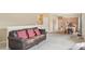 Spacious living room with a couch, seamlessly connected to a dining area and kitchen at 725 High St, Erie, CO 80516