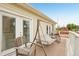 Inviting covered porch featuring a swing and outdoor seating furniture at 725 High St, Erie, CO 80516