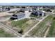 Aerial perspective of a home with a detached garage and land enclosed by white fencing at 31353 E 163Rd Ave, Hudson, CO 80642