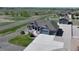 Aerial shot of home with a spacious driveway, manicured lawn, beautiful landscaping and a detached garage at 31353 E 163Rd Ave, Hudson, CO 80642