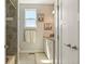 Hall bath with tiled shower, granite countertops, and neutral walls at 31353 E 163Rd Ave, Hudson, CO 80642
