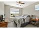 Comfortable bedroom featuring carpet flooring, a ceiling fan, large window, and neutral walls at 31353 E 163Rd Ave, Hudson, CO 80642