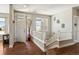 Bright foyer with hardwood floors, staircase, and natural light at 31353 E 163Rd Ave, Hudson, CO 80642