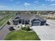 Inviting home with well-maintained landscaping, spacious driveway, three-car garage and beautiful architectural details at 31353 E 163Rd Ave, Hudson, CO 80642